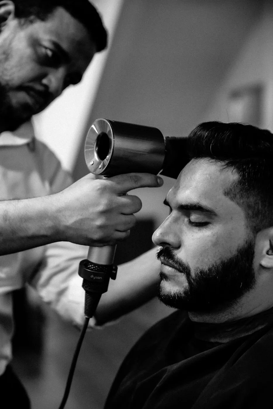 A client's hair being blow-dried after a cut at The British Barbers