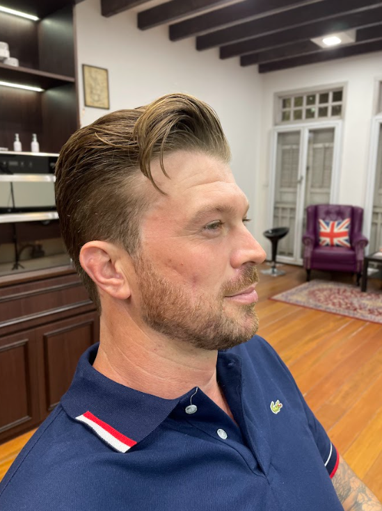 Men's classic side part haircut with beard at premium barbershop in Chinatown Singapore – refined gentleman grooming